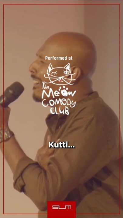 Adin performing stand-up at the Meow Comedy Club