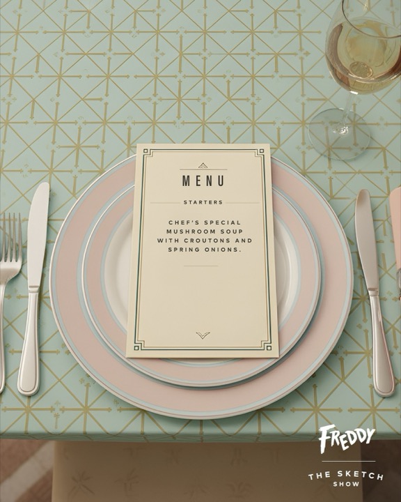 Restaurant menu laid on a set table